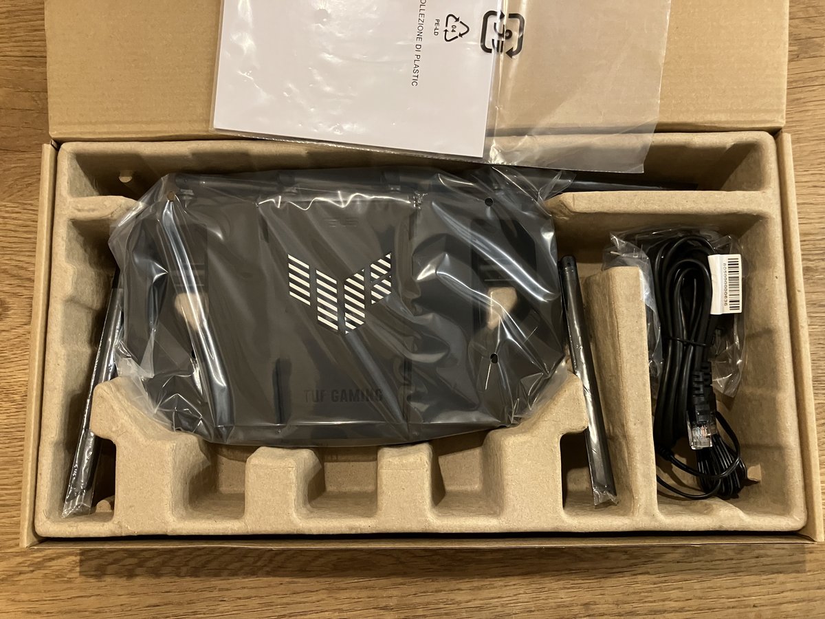 ASUS TUF Gaming BE9400 unboxed, showing 6 antennas