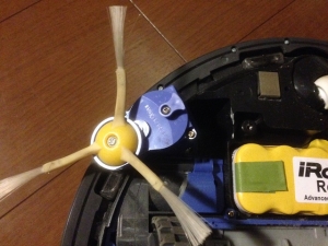 Roomba with new side brush module installed and spinning